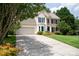 Attractive home with attached garage, mature trees and a large drive at 2019 Steeplechase Dr, Rock Hill, SC 29732