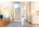 Foyer showcasing stairs, and an open view to living spaces featuring hardwood floors and a fireplace at 2019 Steeplechase Dr, Rock Hill, SC 29732