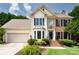 Two-story home with manicured lawn, brick and siding exterior, attached garage, and mature landscaping at 2019 Steeplechase Dr, Rock Hill, SC 29732