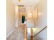 Upstairs hallway view with carpet and traditional lighting fixture leading to adjacent rooms at 2019 Steeplechase Dr, Rock Hill, SC 29732