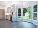 Bright kitchen with stainless steel appliances, light cabinets, and a view of the backyard at 2019 Steeplechase Dr, Rock Hill, SC 29732