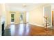 Living room featuring hardwood floors, a fireplace, neutral walls, and a staircase at 2019 Steeplechase Dr, Rock Hill, SC 29732