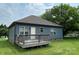 Back exterior showcasing a wooden deck and tidy siding at 210 Rhyne St, Stanley, NC 28164