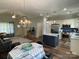 Open concept living area boasts a dining space, living room, and a kitchen with stainless steel appliances at 210 Rhyne St, Stanley, NC 28164