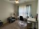 Office space with carpet, neutral paint, fan, and large window offers a versatile space at 210 Rhyne St, Stanley, NC 28164