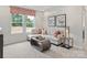 Comfortable living room with neutral decor and large windows at 2143 Rolling Hills Ct, Stanley, NC 28164