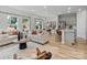 Sunlit open floor plan featuring a comfortable living area that flows seamlessly into a modern kitchen at 2143 Rolling Hills Ct, Stanley, NC 28164