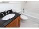 Clean bathroom featuring tile floor, a granite vanity, and a shower-tub combo for all bathing needs at 2628 Clydesdale Ter, Charlotte, NC 28208