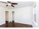 Bright, spacious bedroom with hardwood floors, a ceiling fan, and closet space for storage at 2628 Clydesdale Ter, Charlotte, NC 28208