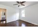 Cozy bedroom with hardwood floors, a ceiling fan, and a window providing ample natural light at 2628 Clydesdale Ter, Charlotte, NC 28208