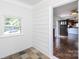 Bright sun room with a large window, unique stone tile flooring, and an open doorway leading to the living area at 2628 Clydesdale Ter, Charlotte, NC 28208