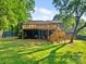 Backyard with a well-maintained lawn, deck, and steps leading to the upper level at 3124 5Th Street Ne Pl, Hickory, NC 28601