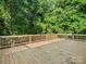 Spacious wooden deck with railing, offering ample space for outdoor relaxation or entertainment at 3124 5Th Street Ne Pl, Hickory, NC 28601