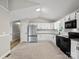 Kitchen featuring white cabinets, granite countertops, stainless steel appliances, and tile flooring at 3124 5Th Street Ne Pl, Hickory, NC 28601