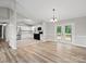 Bright living space featuring a modern kitchen, stainless steel appliances, and French doors to the deck at 3124 5Th Street Ne Pl, Hickory, NC 28601