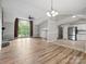 Bright open floor plan with vaulted ceilings, stone fireplace, modern lighting and stainless steel appliances at 3124 5Th Street Ne Pl, Hickory, NC 28601