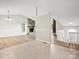 Open-concept space showcasing a stone fireplace and an adjacent living area perfect for gatherings at 3124 5Th Street Ne Pl, Hickory, NC 28601