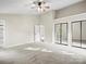 Spacious main bedroom featuring mirrored closet doors and a view of the backyard at 3124 5Th Street Ne Pl, Hickory, NC 28601