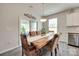Dining area with a wood table, patterned chairs, and sliding glass door at 3145 Bridgewater St, Lancaster, SC 29720