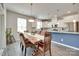 Dining area open to the kitchen has a wood table and views to the kitchen at 3145 Bridgewater St, Lancaster, SC 29720