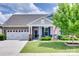 Charming single-story home with a two-car garage, inviting front porch, and manicured lawn at 3145 Bridgewater St, Lancaster, SC 29720