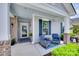 Inviting front porch features stylish seating, a patterned rug, and views into the home at 3145 Bridgewater St, Lancaster, SC 29720