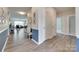 Inviting hallway with wood flooring, neutral paint, and a view into a living area at 3145 Bridgewater St, Lancaster, SC 29720
