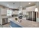 Bright kitchen boasts stainless steel appliances, granite counters, and white cabinetry at 3145 Bridgewater St, Lancaster, SC 29720
