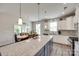 The kitchen overlooks the dining area and features updated appliances and finishes at 3145 Bridgewater St, Lancaster, SC 29720