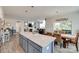 Open floor plan with kitchen island connecting to the dining and living areas at 3145 Bridgewater St, Lancaster, SC 29720