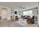 Comfortable living room with built-in shelving, fireplace, ceiling fan and wood flooring at 3145 Bridgewater St, Lancaster, SC 29720