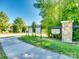 Stone community sign in a lush area, announcing the entrance to The Groves at 3145 Bridgewater St, Lancaster, SC 29720