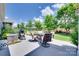 Outdoor patio with a dining set, grill, and views of the landscaped backyard at 3145 Bridgewater St, Lancaster, SC 29720