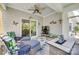 Cozy covered porch with stylish furniture, fan and decor at 3145 Bridgewater St, Lancaster, SC 29720