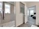 Shower with grey tile and mosaic floor next to open doorway to bedroom at 3145 Bridgewater St, Lancaster, SC 29720