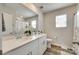 Bright bathroom with double vanity, hard surface countertops, and wood look flooring at 322 Olympia Way, York, SC 29745