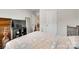 Cozy bedroom featuring a decorative bedspread, dresser, and large mirror at 322 Olympia Way, York, SC 29745