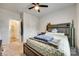 This bedroom features a ceiling fan, neutral walls, and an attached bathroom for added convenience at 322 Olympia Way, York, SC 29745