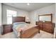 Bedroom with window and matching furniture set, creating a comfortable personal space at 322 Olympia Way, York, SC 29745