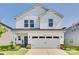 Charming two-story home with a well-manicured lawn and a welcoming front porch at 322 Olympia Way, York, SC 29745