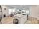 Open kitchen featuring a large island with seating and easy access to the dining and living areas at 322 Olympia Way, York, SC 29745