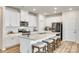 Bright, modern kitchen with a large island, granite countertops and stainless steel appliances at 322 Olympia Way, York, SC 29745