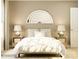 Comfortable bedroom with a cozy bed, side tables with lamps, and a decorative rainbow mirror for added charm at 3887 Horsham St, Indian Land, SC 29707