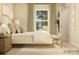 Inviting bedroom with a queen-sized bed, soft lighting, and a serene ambiance at 3887 Horsham St, Indian Land, SC 29707