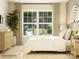 Inviting bedroom showcasing a large window, natural light, stylish decor, and a relaxing atmosphere at 3887 Horsham St, Indian Land, SC 29707