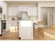 Stylish kitchen with white cabinets, stainless steel appliances, and a breakfast bar at 3887 Horsham St, Indian Land, SC 29707