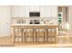 Modern kitchen with white cabinets, stainless steel appliances, and a breakfast bar at 3887 Horsham St, Indian Land, SC 29707
