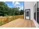 New wooden back deck overlooking fenced-in yard at 3903 Plainview Rd, Charlotte, NC 28208