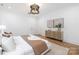 Bright main bedroom with natural light, wood floors, stylish decor and a neutral color palette at 3903 Plainview Rd, Charlotte, NC 28208