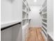 Spacious walk-in closet with built-in shelving, drawers, and hanging rods providing ample storage at 3903 Plainview Rd, Charlotte, NC 28208